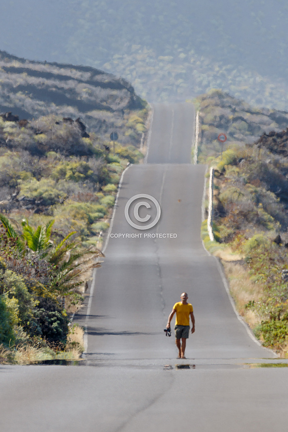 Man walking on road - El Hierro